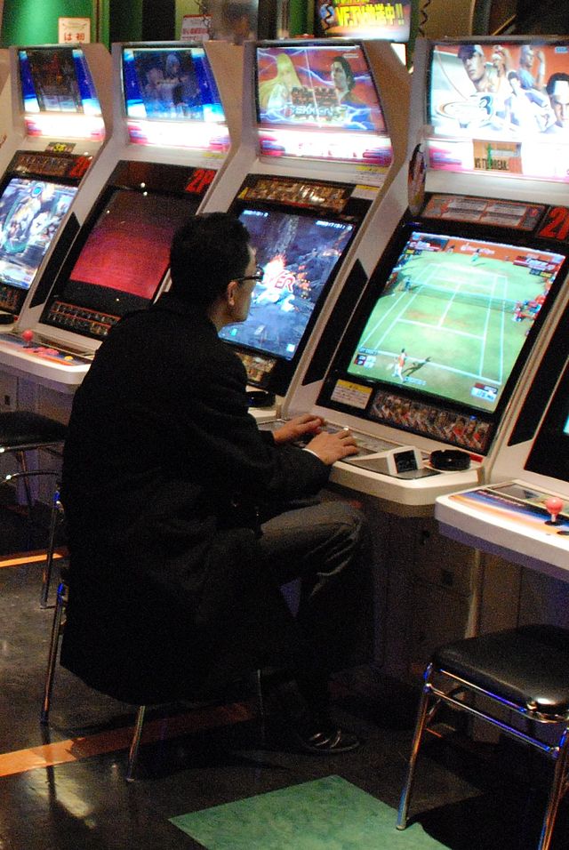 Arcade gamer (photo by W.J. Andersen, CC-BY-SA 2.0)